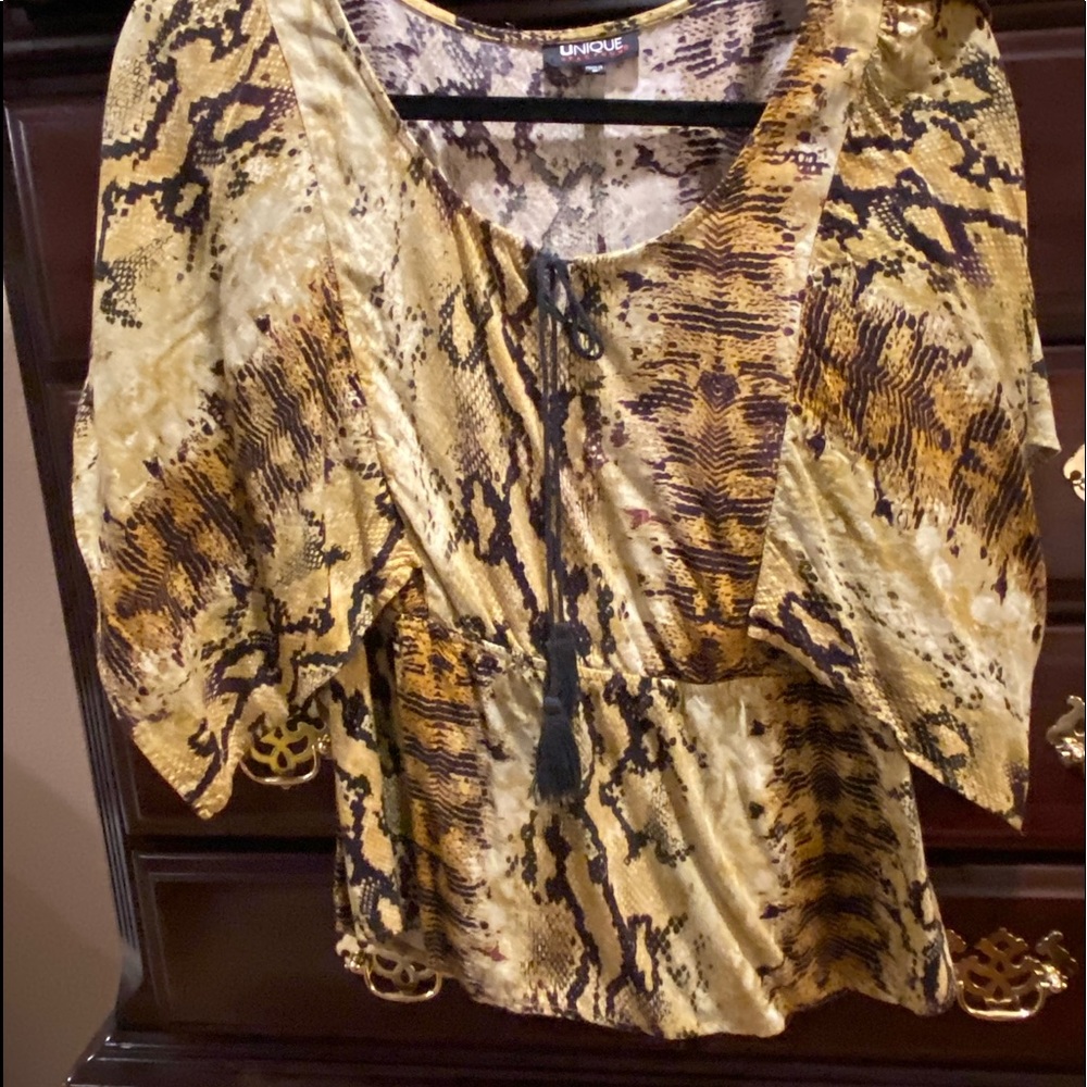 Printed flair shirt with sleeves that that flow.
